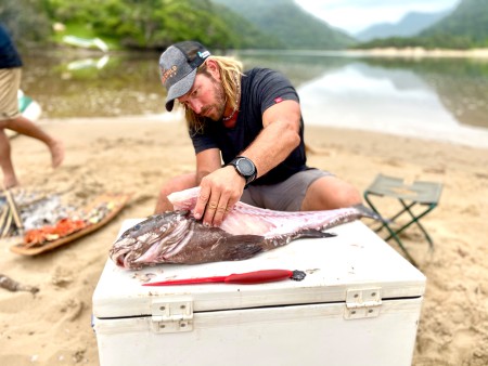 SA. Wild Coast. Cleaning fish