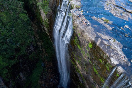 Waterfall with guys over head...